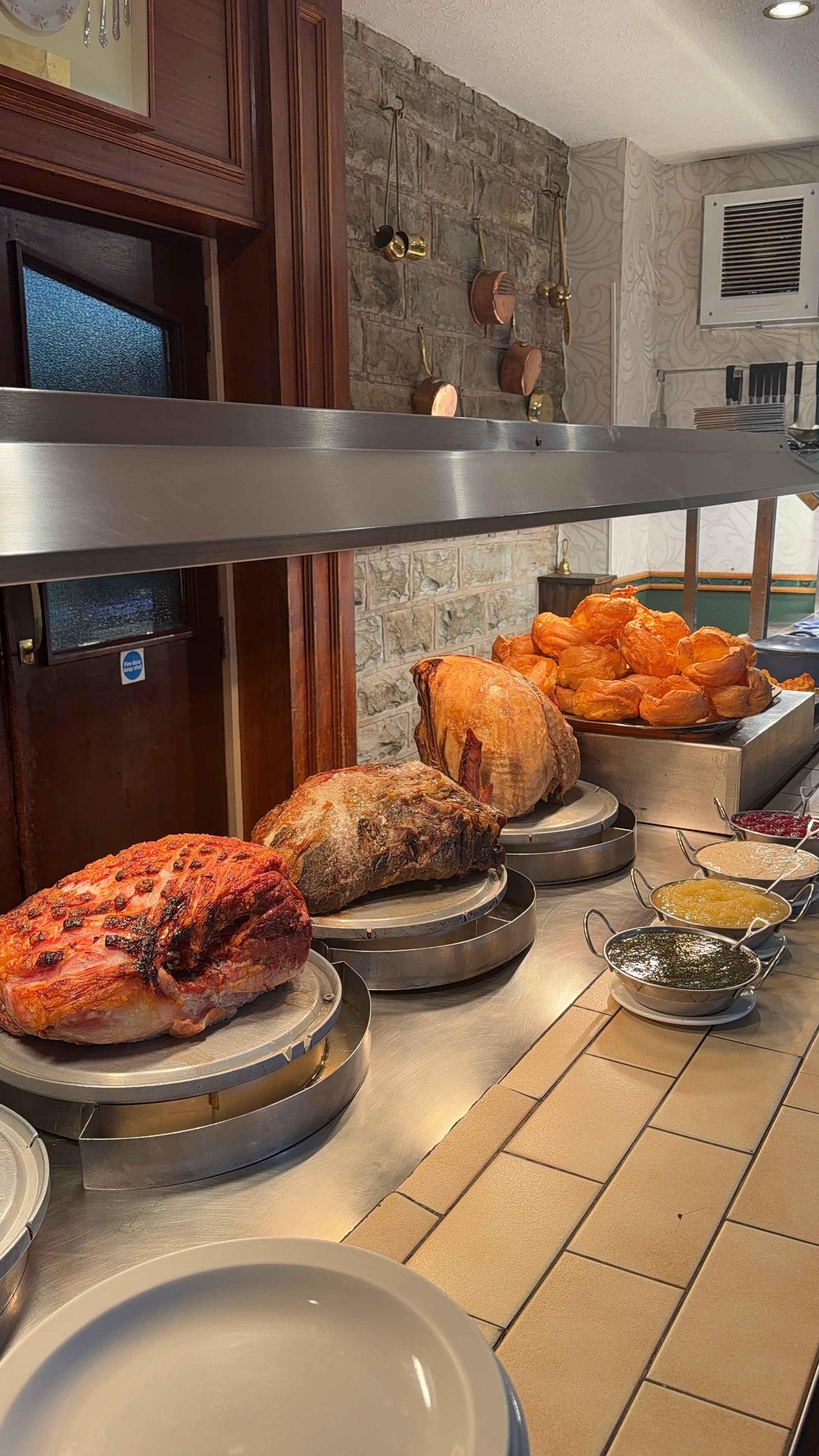 The Rose 'N' Bowl carvery counter with glazed gammon, roast beef, whole turkey and condiments